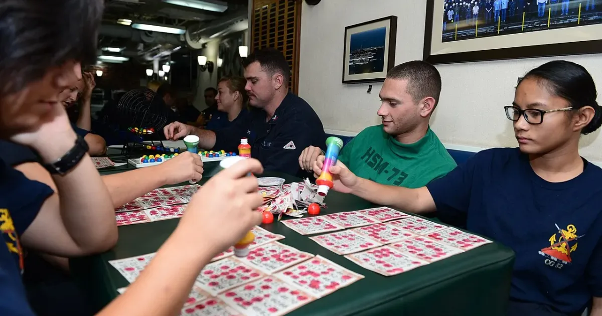 Players concentrating on their bingo cards during game