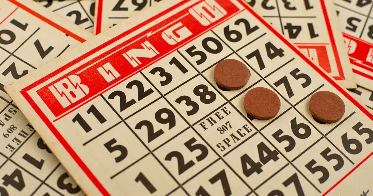 Classic bingo card with round chips placed on called numbers