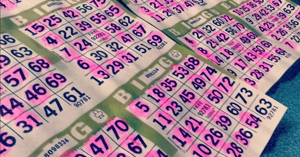 Stack of bingo game sheets with printed number grids
