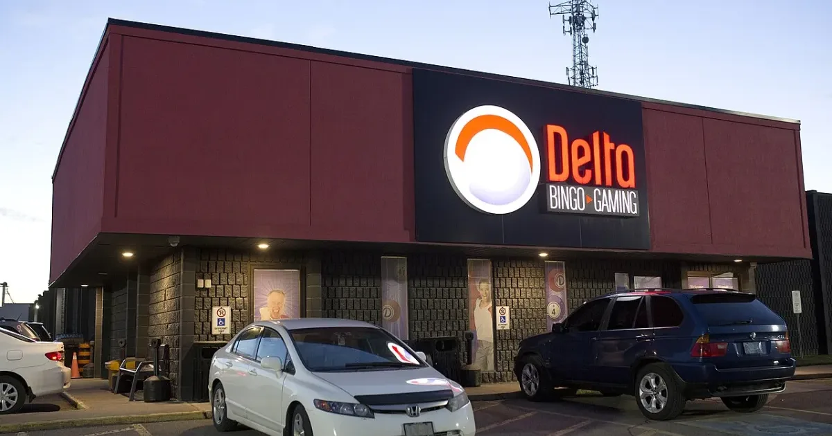 Exterior of a bingo hall with illuminated sign at dusk
