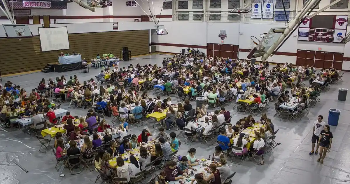 Large crowd playing bingo at a community hall event