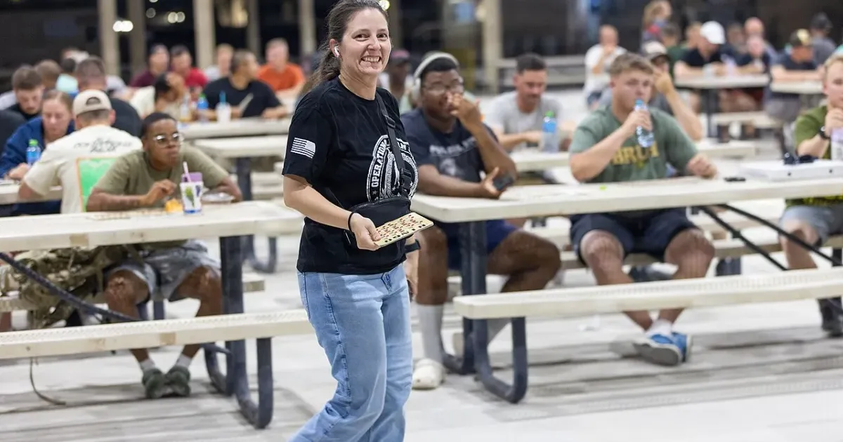 Excited bingo winner walking to collect prize at large event