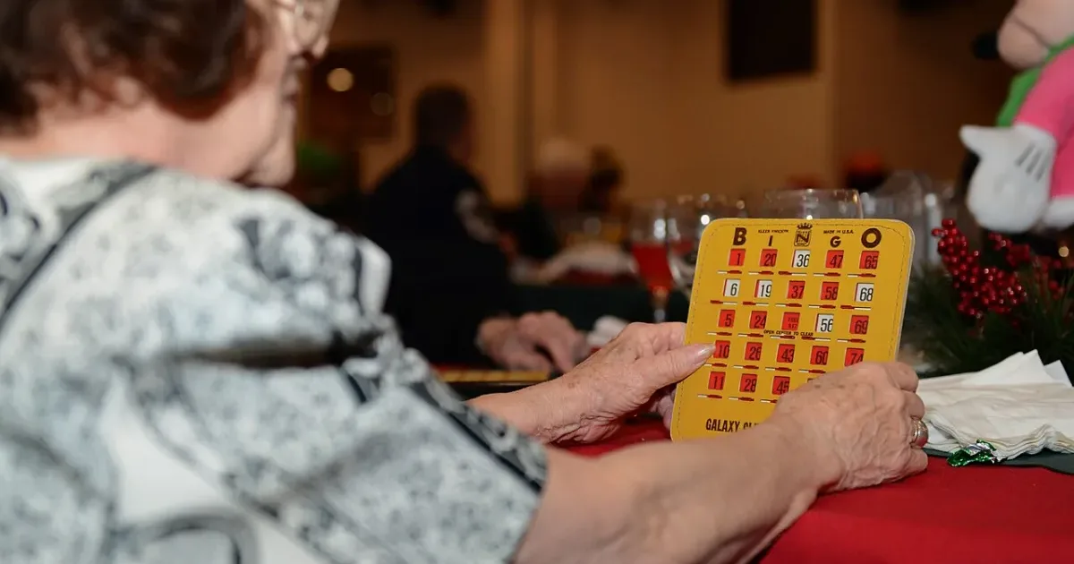 Seniors enjoying bingo at a festive Christmas event